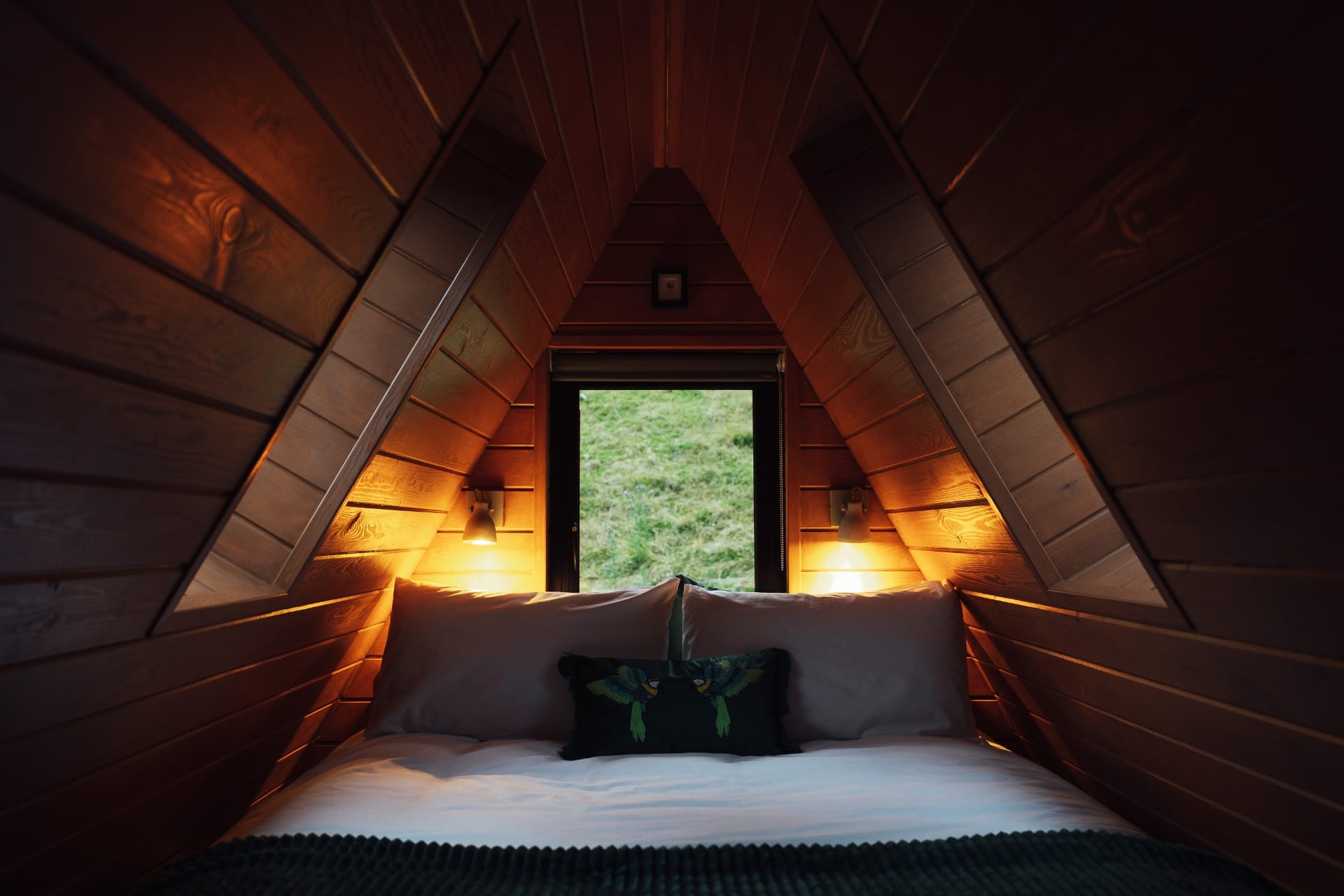 King-size mezzanine bedroom under the A-frame rafters inside The Perch