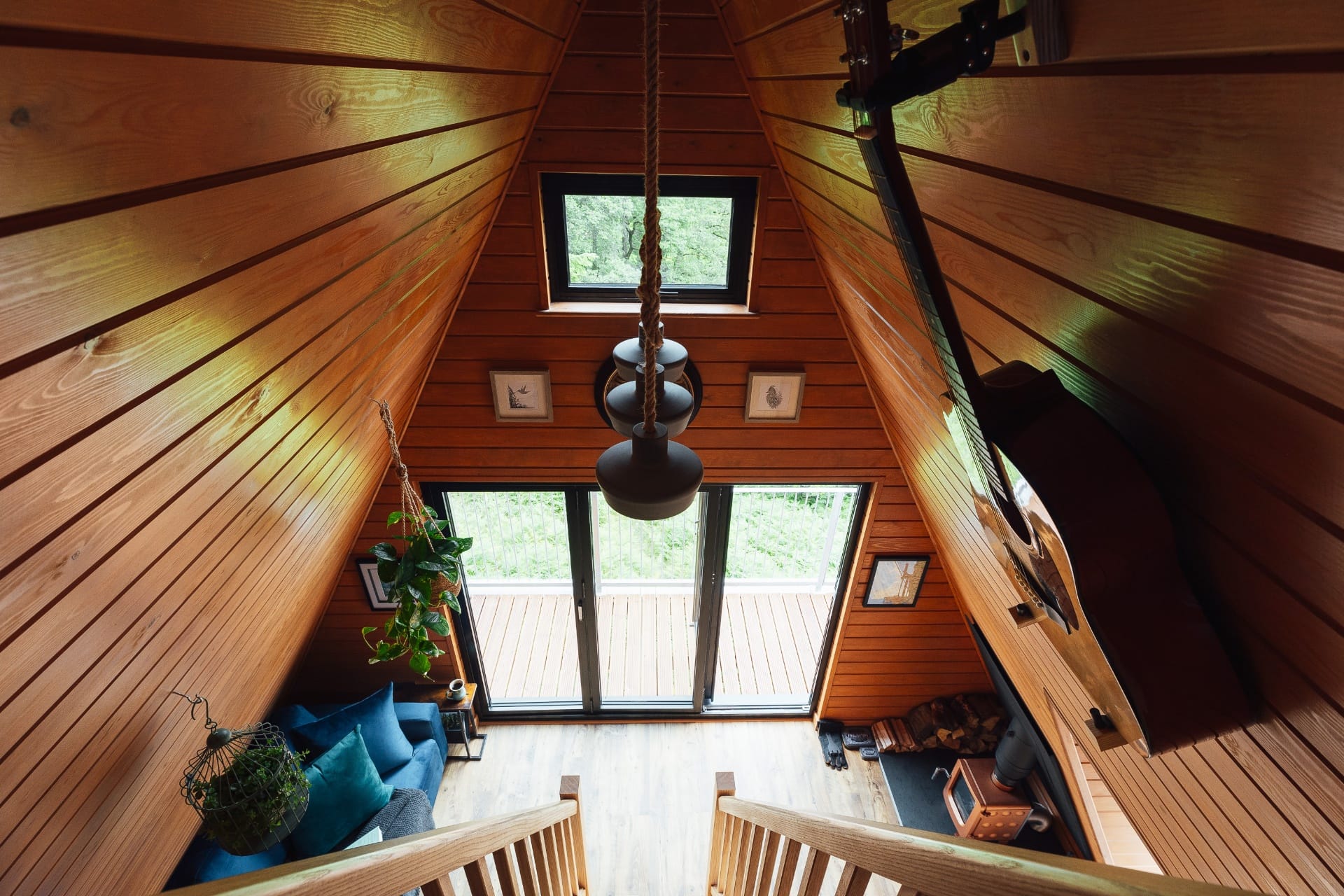 View down from the mezzanine onto the living space and bifold doors
